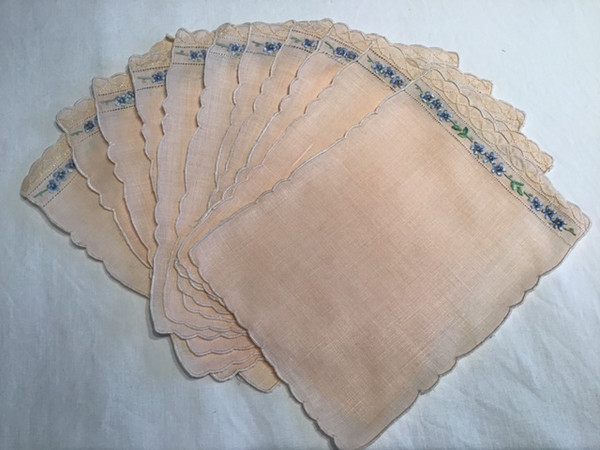 11 salmon colored vintage linen cocktail napkins with adorable embroidery at one side