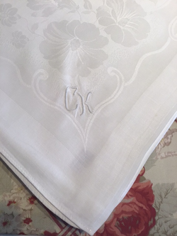 Small silky damask table cloth with monogram “CK”