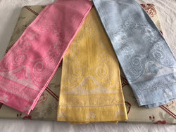 3 brightly colored huck weave tea towels