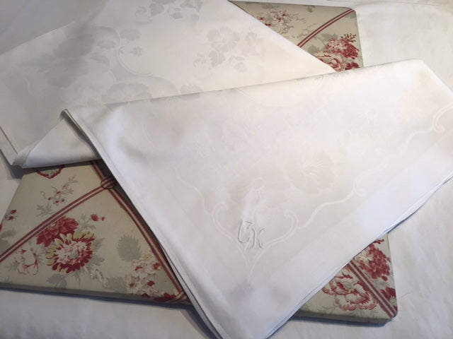 Small silky damask table cloth with monogram “CK”