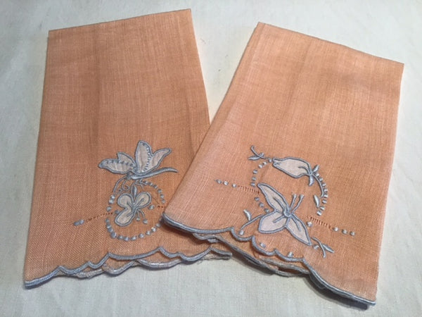 Pair of Apricot-colored embroidered/appliqued fingertip towels