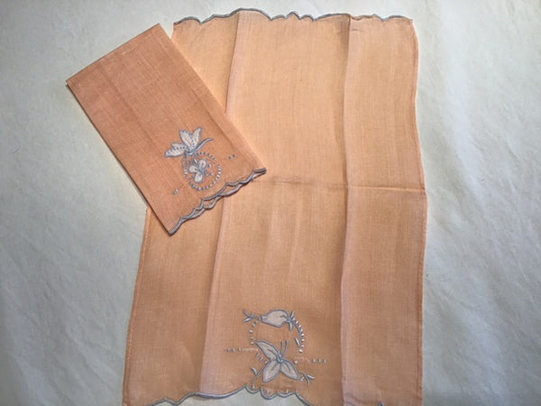 Pair of Apricot-colored embroidered/appliqued fingertip towels